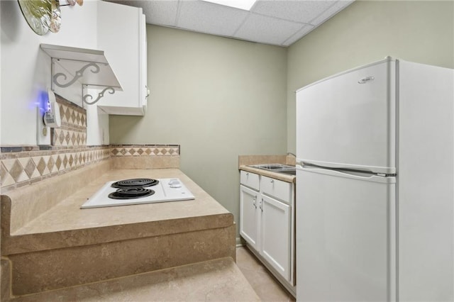 4135 Ashford Way, Gainesville, GA 30507 - kitchen with a drop ceiling, white appliances, a sink, light countertops, and white cabinets