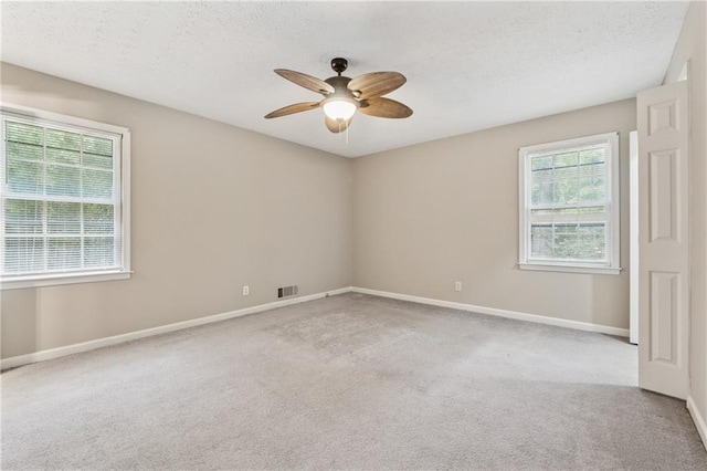 6010 White Oak Ct NW, Kennesaw, GA 31052 - carpeted empty room featuring ceiling fan and a textured ceiling