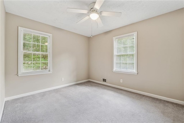 6010 White Oak Ct NW, Kennesaw, GA 31052 - empty room with carpet floors, a textured ceiling, and a ceiling fan