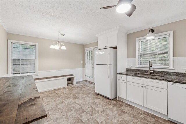 6010 White Oak Ct NW, Kennesaw, GA 31052 - kitchen with white appliances, crown molding, white cabinetry, dark stone counters, and ceiling fan