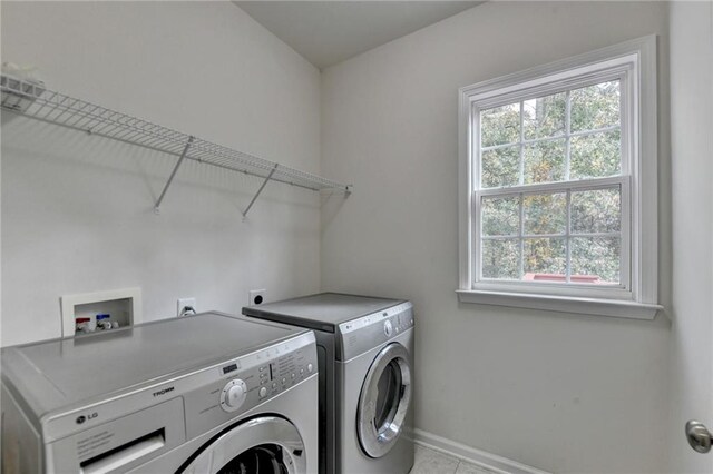 laundry room with separate washer and dryer