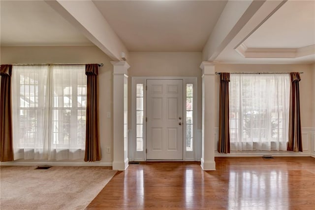 entrance foyer with hardwood / wood-style flooring and decorative columns