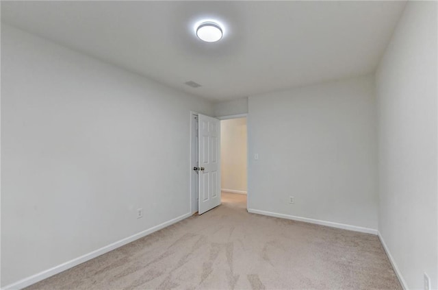 empty room with light colored carpet