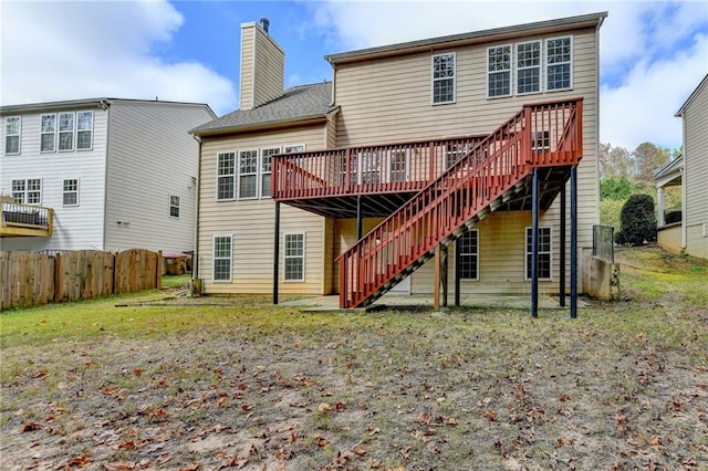 rear view of house featuring a deck