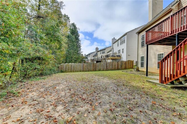 view of yard featuring a wooden deck