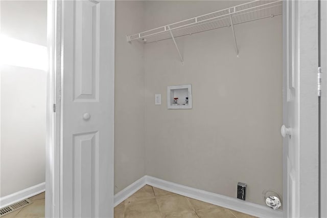 laundry room with light tile patterned floors and washer hookup