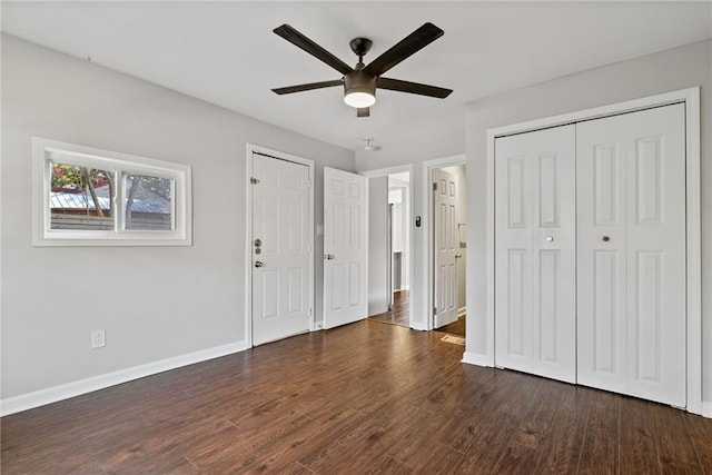 unfurnished bedroom with ceiling fan and dark hardwood / wood-style flooring