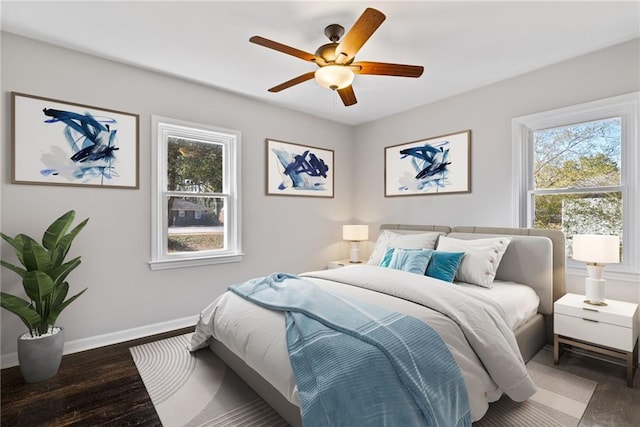 bedroom featuring dark wood-type flooring and ceiling fan