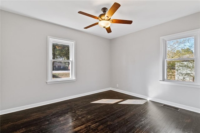 spare room with ceiling fan and wood-type flooring