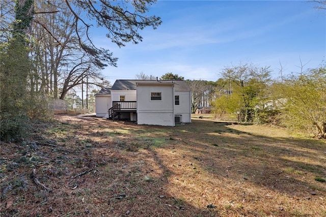 rear view of property with a wooden deck