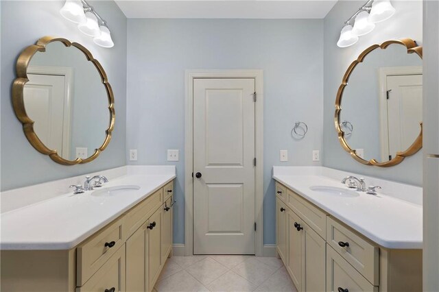 bathroom featuring tile patterned flooring and vanity