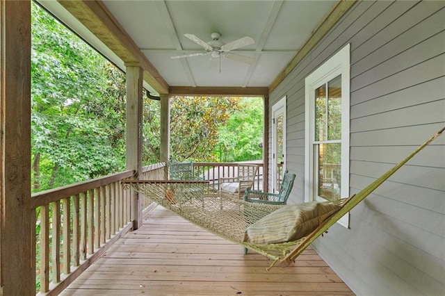 deck featuring ceiling fan and a porch