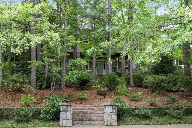 view of property hidden behind natural elements