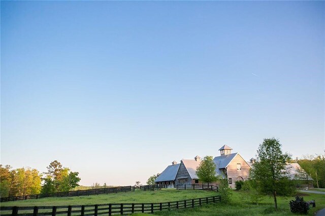 view of yard with a rural view