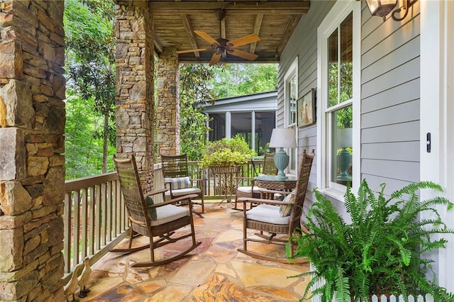 exterior space featuring ceiling fan and a sunroom