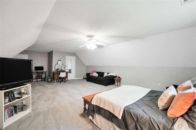 bedroom with vaulted ceiling, visible vents, carpet, and a ceiling fan