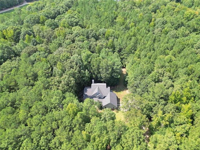 drone / aerial view featuring a forest view