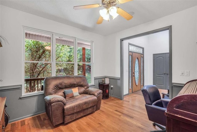 office featuring ceiling fan and light wood-style floors