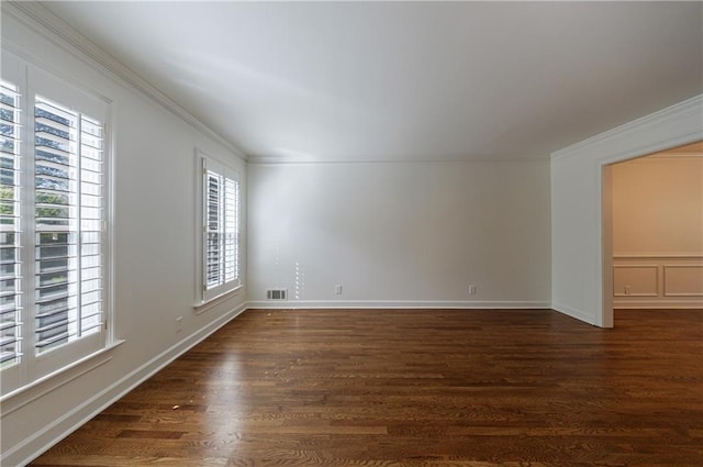 5004 Haralson Way SW, Lilburn, GA 30047 - spare room featuring dark wood-style floors and crown molding