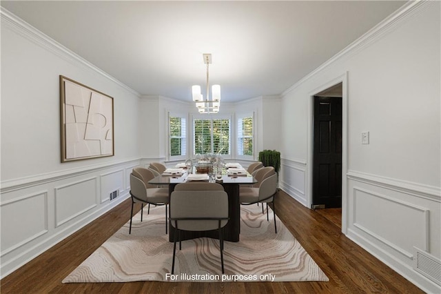 5004 Haralson Way SW, Lilburn, GA 30047 - dining area featuring a chandelier, dark wood-style flooring, a decorative wall, ornamental molding, and a wainscoted wall