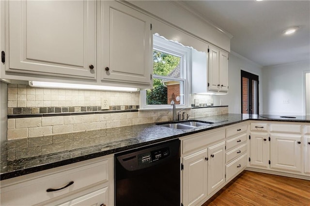 5004 Haralson Way SW, Lilburn, GA 30047 - kitchen with dishwasher, white cabinets, crown molding, dark stone countertops, and backsplash