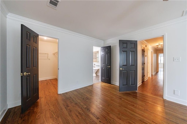 5004 Haralson Way SW, Lilburn, GA 30047 - spare room featuring wood finished floors and crown molding