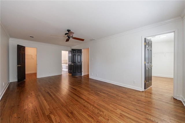 5004 Haralson Way SW, Lilburn, GA 30047 - empty room with ceiling fan, wood finished floors, and crown molding