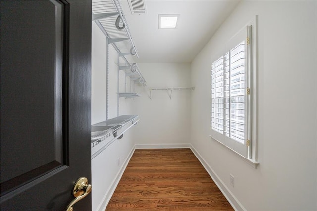 5004 Haralson Way SW, Lilburn, GA 30047 - spacious closet featuring dark wood finished floors