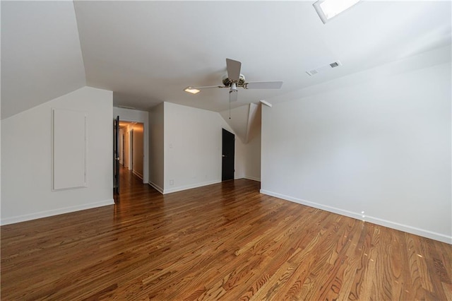 5004 Haralson Way SW, Lilburn, GA 30047 - spare room featuring a ceiling fan, lofted ceiling, and wood finished floors
