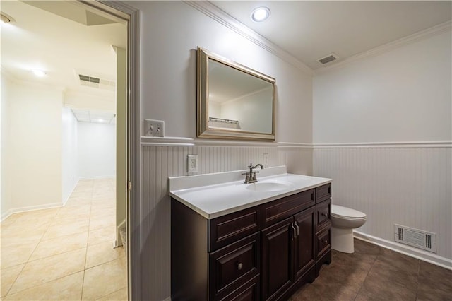 5004 Haralson Way SW, Lilburn, GA 30047 - bathroom featuring vanity, tile patterned flooring, a wainscoted wall, and crown molding
