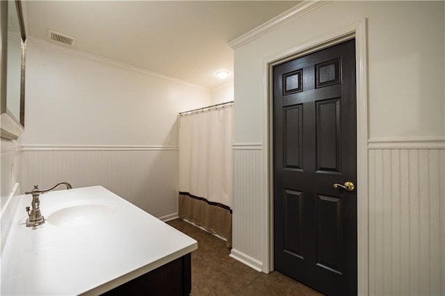 5004 Haralson Way SW, Lilburn, GA 30047 - bathroom with wainscoting, vanity, crown molding, tile patterned flooring, and a shower with curtain