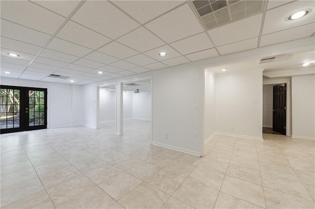 5004 Haralson Way SW, Lilburn, GA 30047 - unfurnished room with light tile patterned floors, french doors, a paneled ceiling, and recessed lighting