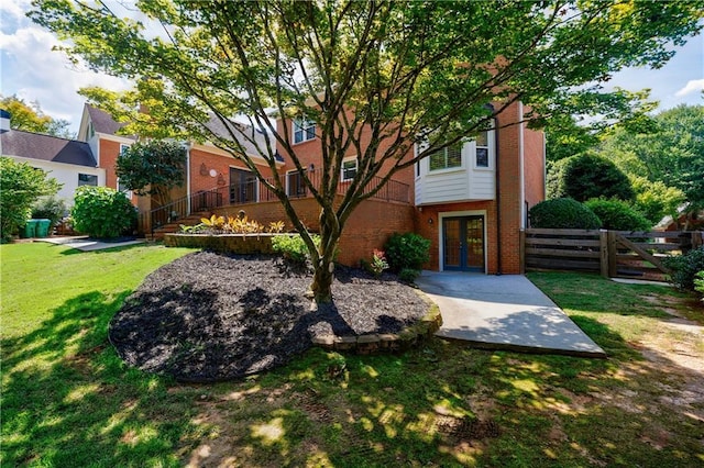 5004 Haralson Way SW, Lilburn, GA 30047 - view of front of home with french doors, brick siding, and a patio