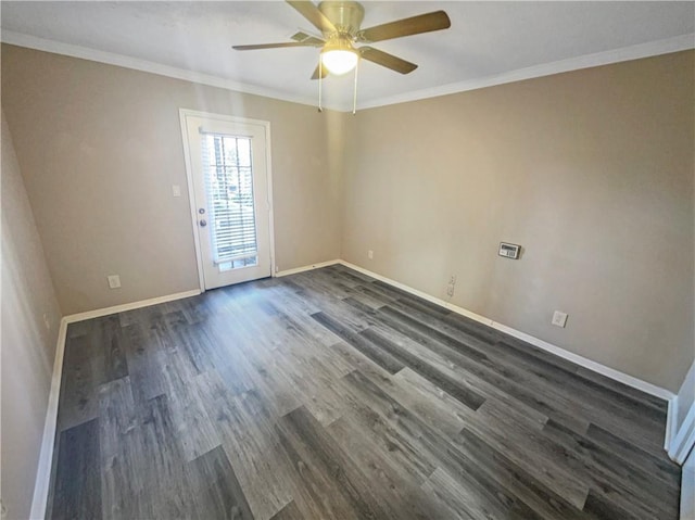 empty room with ceiling fan, dark hardwood / wood-style flooring, and crown molding