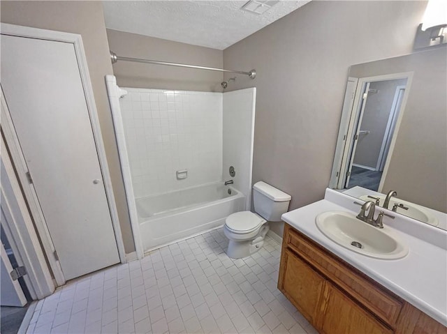 kitchen with appliances with stainless steel finishes, light tile patterned floors, ceiling fan, and sink