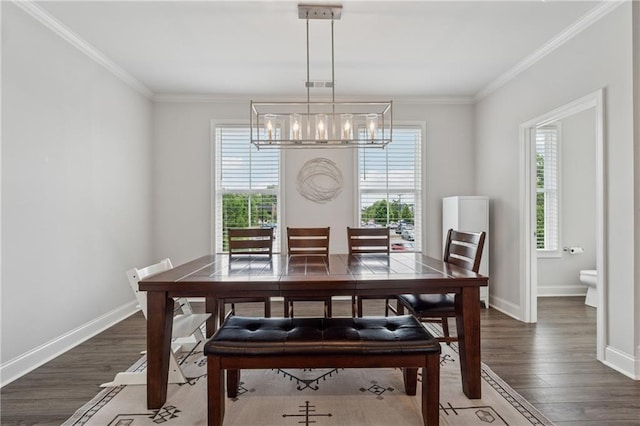 3440 Hardy St, Duluth, GA 30096 - dining area featuring a chandelier, wood finished floors, and crown molding