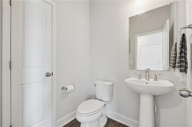 3440 Hardy St, Duluth, GA 30096 - bathroom featuring baseboards and wood finished floors