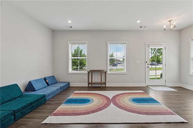 3440 Hardy St, Duluth, GA 30096 - living area featuring healthy amount of natural light, a chandelier, wood finished floors, and recessed lighting