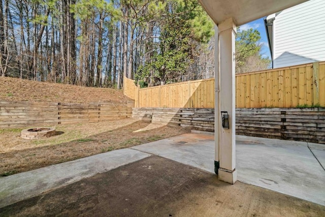 view of patio / terrace with a fenced backyard and an outdoor fire pit