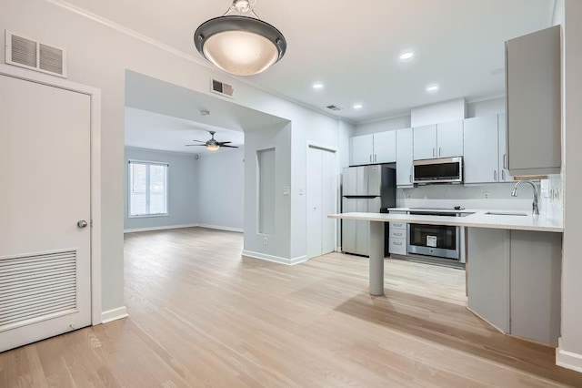 bathroom featuring hardwood / wood-style flooring and crown molding