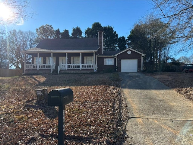 view of front of property featuring a garage and covered porch