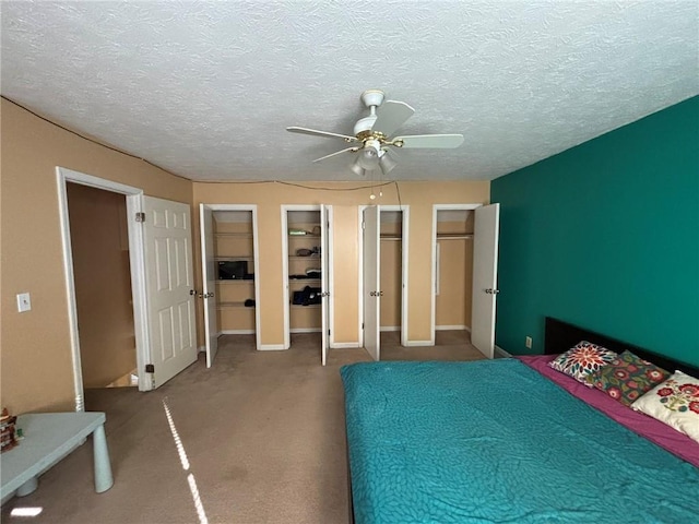 unfurnished bedroom featuring a textured ceiling, ceiling fan, and carpet floors