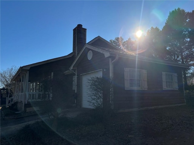 view of property exterior featuring a garage