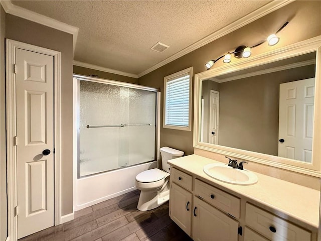 full bathroom featuring vanity, wood finished floors, visible vents, crown molding, and toilet