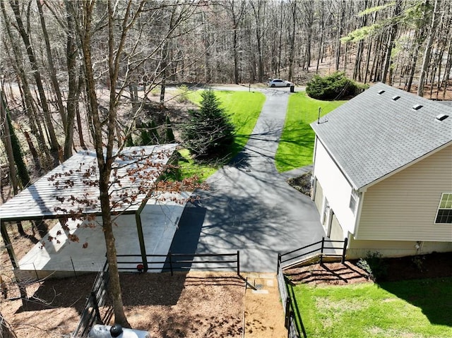 birds eye view of property with a forest view