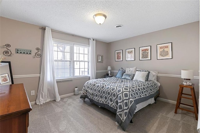 bedroom with baseboards, visible vents, and carpet flooring