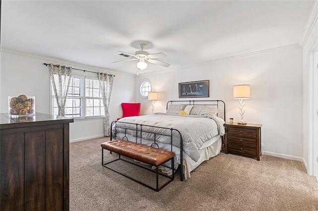 bedroom with a ceiling fan, carpet, baseboards, and crown molding