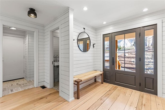 interior space featuring ornamental molding, recessed lighting, and wood-type flooring