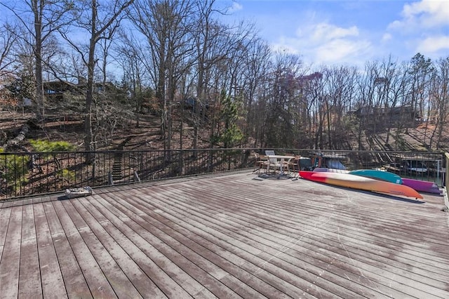 wooden deck with outdoor dining area