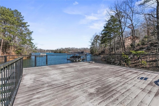 wooden deck featuring a water view